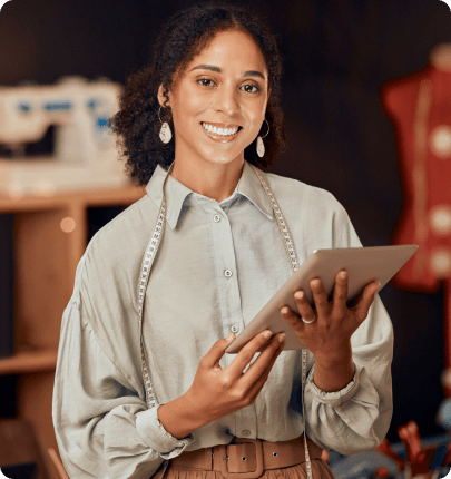 A happy Spenda customer using a tablet computer