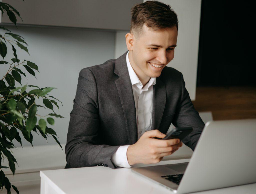 Man on a computer using unsecured business loan via virtual credit card